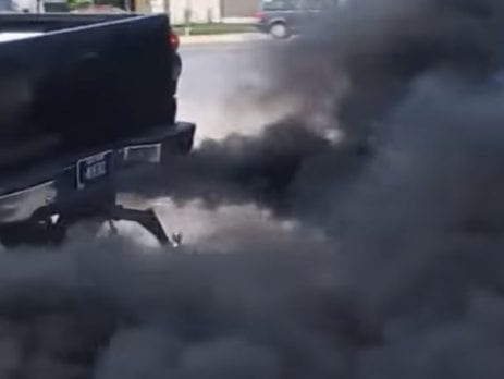 Black Diesel Ute blowing black smoke out of the exhaust