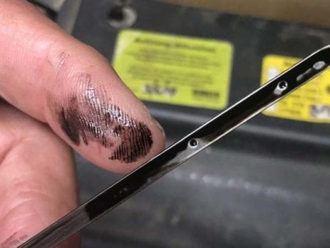 Dirty black diesel oil from a Toyota Prado