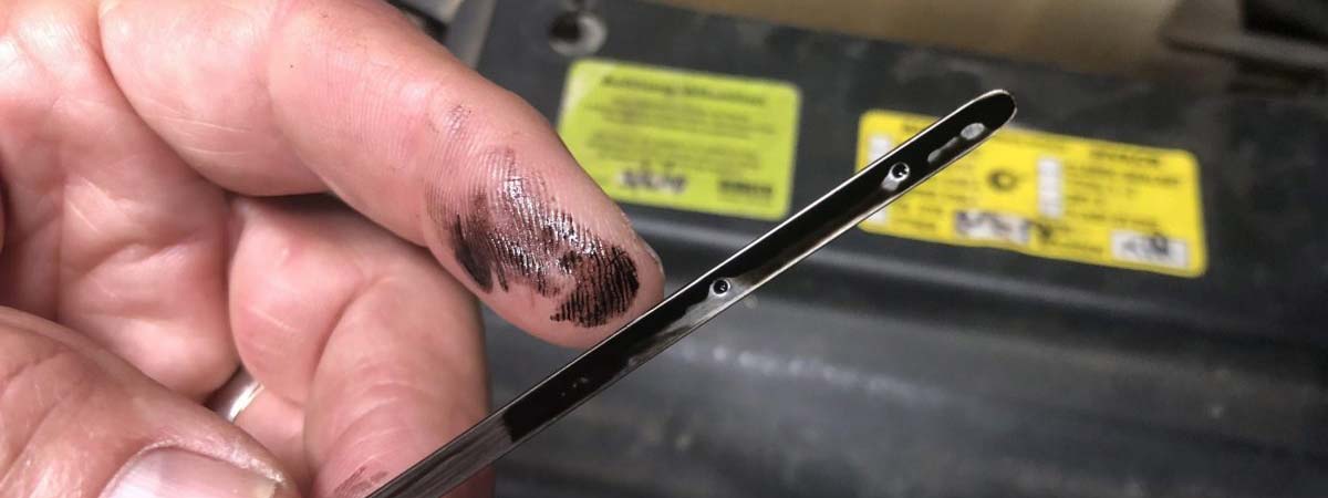 Dirty black diesel oil from a Toyota Prado