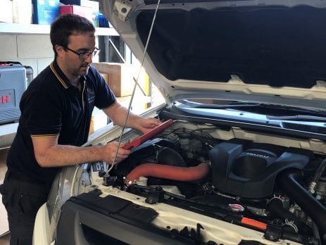 Diagnostic injector testing being completed on a Isuzu work vehicle