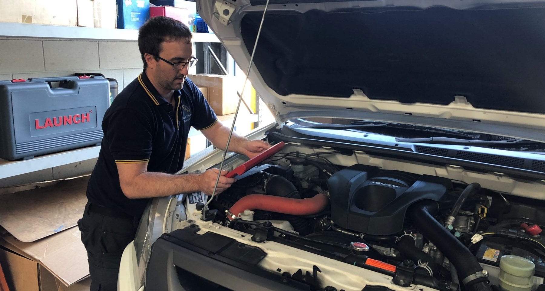 Diagnostic injector testing being completed on a Isuzu work vehicle